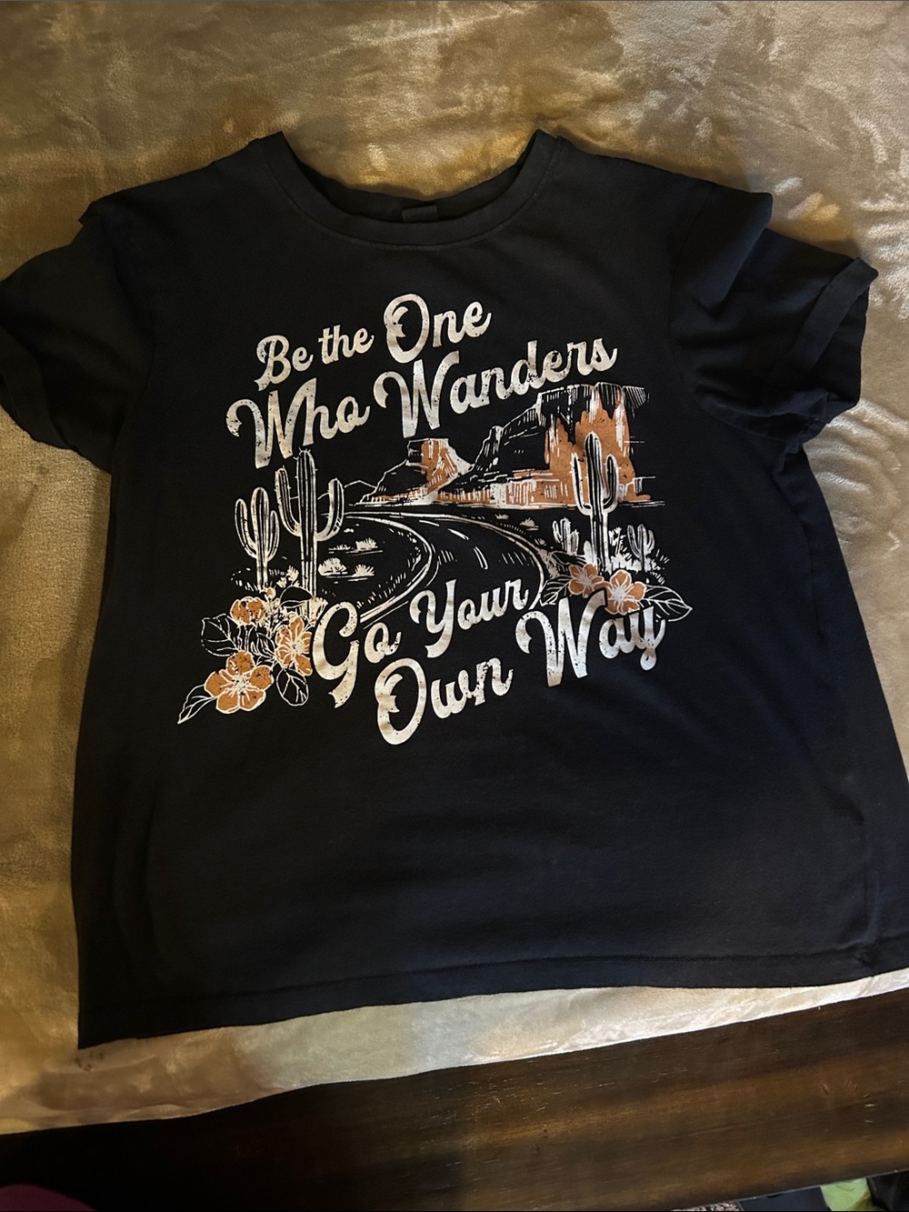 Women's Black Graphic Tee - 'Be the One Who Wanders'